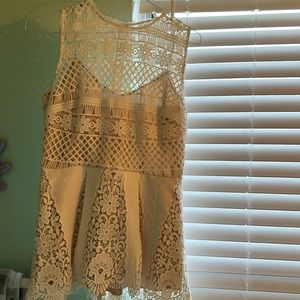 Ellie Tahari designer elegant dress halter top. Fabric is a durable eyelet.